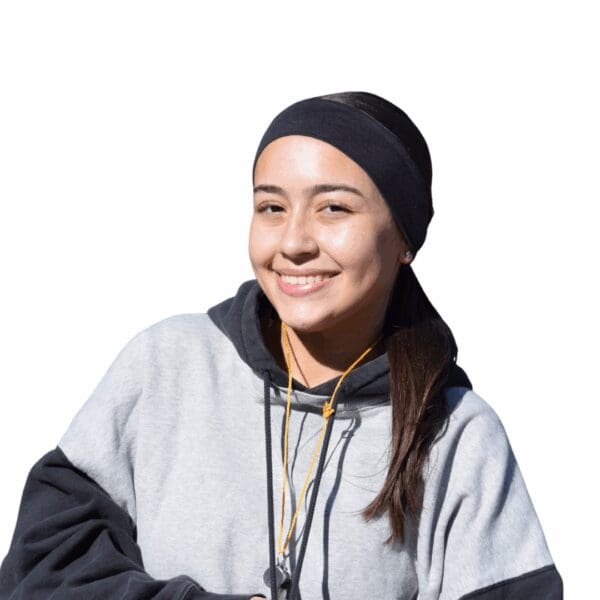 Smiling girl wearing hoodie and headband.
