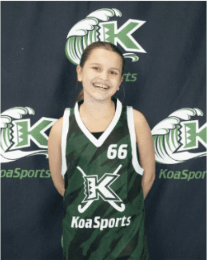 Smiling girl in green KoaSports jersey